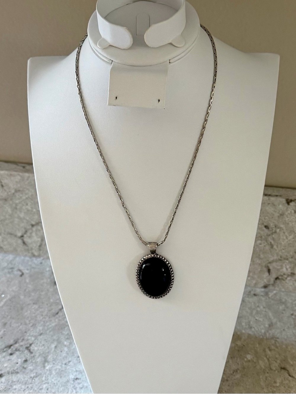 Silver-Tone Necklace with Black Oval Pendant